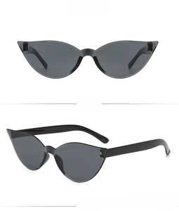Detail view showing grey cat eye sunglasses with translucent frames and UV lenses