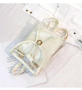 Detailed top view of a transparent PVC backpack featuring a white drawstring inner pouch