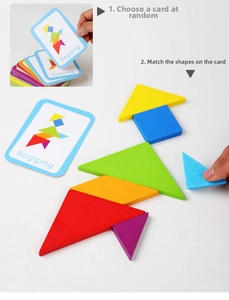 Detail of colorful wooden tangram shapes with instructional guide cards for kids