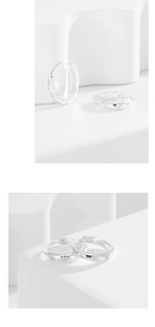 Close-up of S925 sterling silver star hoop earrings with white zircon stone inlay