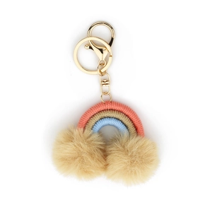 Detail of woven rainbow keychain with coral and blue cords and soft beige pom poms