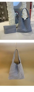 Detail view of denim blue woven tote bag set including a matching zipper pouch