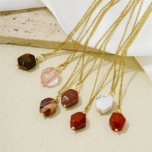 Minimalist gold chain necklace with colorful hexagonal gemstone pendants set on silk