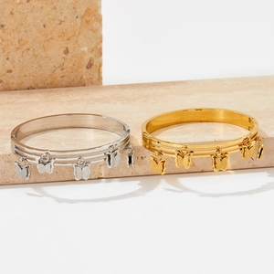 Three-layer stainless steel butterfly bangles in gold and silver with frosted texture