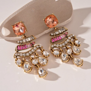 Vintage gold earrings with pink square crystals and hanging white teardrop rhinestones