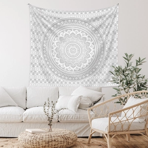 Detail of bohemian mandala tapestry featuring white and grey geometric patterns for home decor