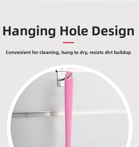 Pink silicone brush handle detail showing the hanging hole design for easy storage