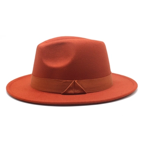 Detailed view of caramel wool fedora hat with a flat brim and matching ribbon trim