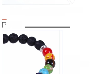 Macro shot of 7 Chakra yoga energy bracelet with colorful natural stones and lava beads