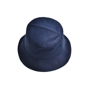 Detailed macro view of navy blue cotton twill fabric and stitching on a bucket hat