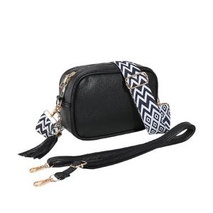 Black pebble leather crossbody bag with geometric woven strap and gold hardware accents