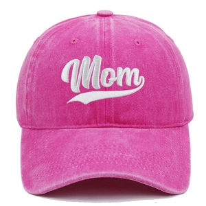 Detailed view of pink washed cotton baseball cap with white Mom embroidery stitching