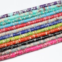 Macro shot of colorful flat round natural stone spacer beads with unique textures