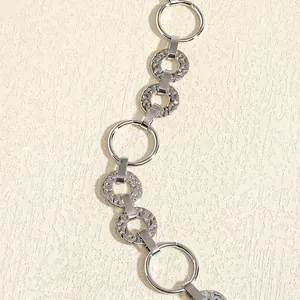 Polished silver metal waist chain belt with textured circular links for women's dresses