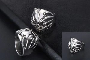 Detailed view of punk skull ring in silver titanium steel with bold relief craftsmanship