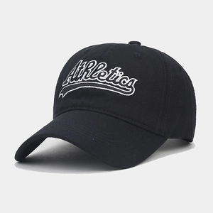 Close-up of white Athletics embroidery on a black vintage baseball cap fabric