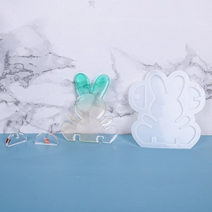 Detail view of rabbit silicone mold with green gradient resin craft and stand bases