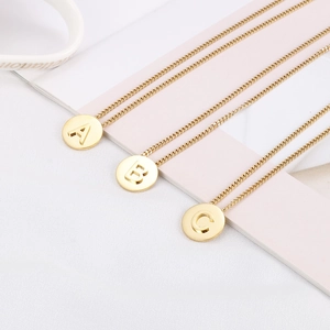Polished gold titanium steel necklaces with circular A, B, and C initial pendants