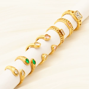 French vintage gold stainless steel rings with zircon stones displayed on silk