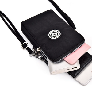 Mini sac à bandoulière noir en nylon avec poches zippées multicouches et sangle réglable