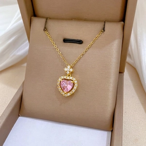 Elegant gold titanium steel necklace featuring a sparkling pink heart pendant with diamonds
