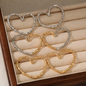 Textured 316 stainless steel heart hoop earrings set in gold and silver finishes