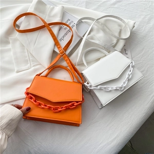Minimalist square flap bag with resin chain detail in orange and white leather