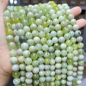 Macro shot of 8-10mm translucent light green crystal beads for DIY jewelry making