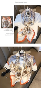 Detail of elegant champagne silk scarf with metal chain and floral pattern with accessories