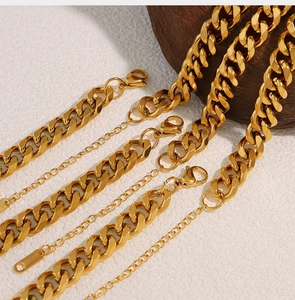 Detailed macro view of 18K gold plated stainless steel Cuban link chain with S.STEEL mark