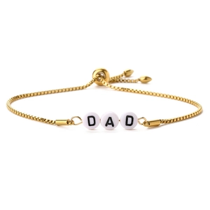 Macro shot of 14K gold-plated box chain bracelet with DAD letter beads and slider clasp