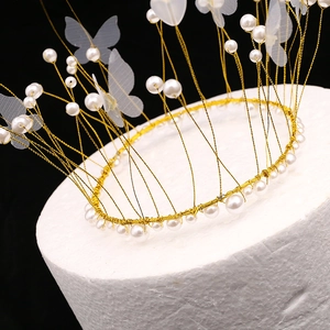 Elegant gold wire birthday cake topper crown with white pearls and mesh butterfly