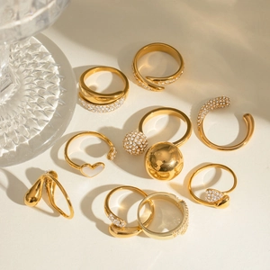 Group of 18k gold plated stainless steel open rings with heart detail and zircons