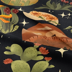 Close-up of soft fabric texture featuring moon, stars and desert cactus tapestry print