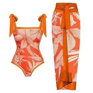 Floral print one-piece swimsuit with matching sarong wrap in orange and white