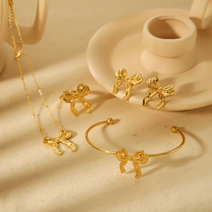 Elegant 18k gold plated stainless steel jewelry set with 3D bow necklace and rings