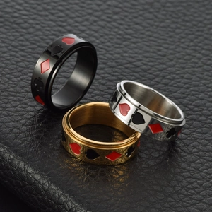 Lot de trois bagues rotatives en acier inoxydable noir, argent et or avec motifs poker