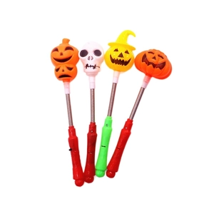 Colorful LED Halloween glowing spring sticks with pumpkin and skull designs for kids
