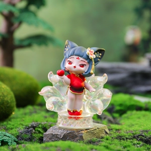 Close-up of Nine-Tailed Fox fairy figurine in red cheongsam with translucent colorful tails