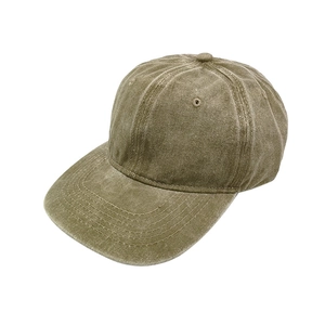 Detailed close-up of vintage washed olive cotton canvas baseball cap with distressed texture