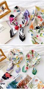 Detail showing high-quality silk texture and exquisite stitching on printed square scarves