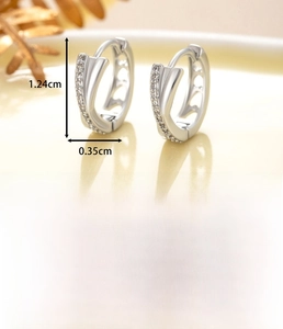 Detailed view of silver cross earrings with zircon stones and dimensions 1.24x0.35cm