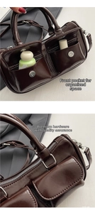 Detail of dark brown glossy leather saddle bag featuring dual front functional pockets