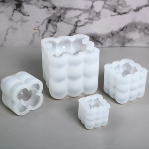 Stack of flexible silicone bubble cube molds for DIY handmade candle and soap making