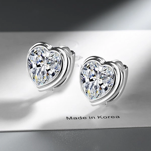 Elegant heart-shaped silver earrings with sparkling clear cubic zirconia stones