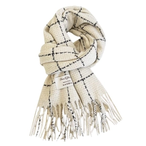 Minimalist black and white plaid scarf with decorative fringes on a clean white backdrop