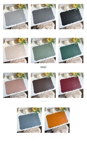 Collage of eleven colored faux leather placemats with baroque embossed floral textures
