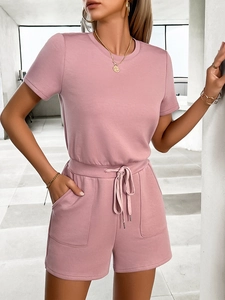 Detail view of pink casual short set featuring drawstring waist and pockets on soft fabric