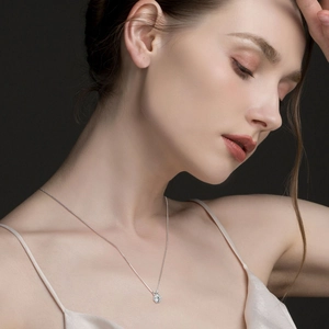Elegant S925 sterling silver six-prong moissanite pendant necklace on model