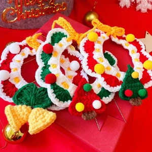 Detailed macro view of handmade crochet Christmas pendants with bell and tree ornaments